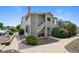 Exterior of condo featuring a patio, walkway, and landscaped grounds at 8437 Thunder Ridge Way # 202, Highlands Ranch, CO 80126