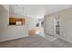 Spacious living room flowing into a dining area and kitchen at 8437 Thunder Ridge Way # 202, Highlands Ranch, CO 80126