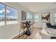 Cozy breakfast nook with a small table, two chairs, large windows, and natural light at 15290 W 69Th Pl, Arvada, CO 80007