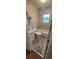 Well-lit bathroom featuring tiled walls, a white vanity, toilet, and a shower-tub combination at 2880 W 91St Pl, Denver, CO 80260