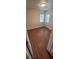 Cozy bedroom featuring wood floors, neutral walls, two windows, and white trim at 2880 W 91St Pl, Denver, CO 80260