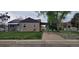 Charming home with a landscaped front yard, long driveway, and covered parking at 2880 W 91St Pl, Denver, CO 80260