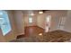 Inviting living room with wood floors, neutral walls, and views into the kitchen at 2880 W 91St Pl, Denver, CO 80260