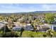 Aerial view of the home, backyard, and neighborhood, highlighting the outdoor space and mountain views at 10895 W Bowles Pl, Littleton, CO 80127