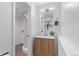 Functional bathroom featuring a shower, single sink vanity, and neutral finishes at 10895 W Bowles Pl, Littleton, CO 80127