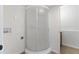 Compact bathroom featuring a shower, in-unit laundry hook-ups, and neutral finishes at 10895 W Bowles Pl, Littleton, CO 80127