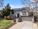 Charming two-story home with a well-manicured front yard and attached two-car garage at 10895 W Bowles Pl, Littleton, CO 80127