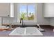 Close-up of a kitchen sink with a dark faucet and a bright view from the window at 10895 W Bowles Pl, Littleton, CO 80127
