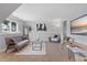 Bright living room offering cozy seating, natural light, modern decor, and a flatscreen TV at 10895 W Bowles Pl, Littleton, CO 80127