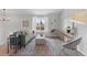 Bright living room with comfortable seating, stylish decor, and large window offering natural light at 10895 W Bowles Pl, Littleton, CO 80127