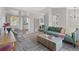 Open concept living area featuring modern furnishings, neutral tones, and ample space for entertaining at 10895 W Bowles Pl, Littleton, CO 80127