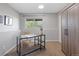 Bright office featuring a workspace, natural light, minimalist decor, and storage cabinetry at 10895 W Bowles Pl, Littleton, CO 80127