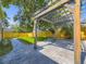 Beautifully landscaped backyard with a pergola, stone patio, and lush green lawn at 1350 E Amherst Ave, Englewood, CO 80113