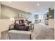 Relaxing finished basement boasts a cozy seating area and a convenient kitchenette at 1350 E Amherst Ave, Englewood, CO 80113