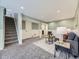 Finished basement provides a spacious living area with comfortable seating and carpet flooring at 1350 E Amherst Ave, Englewood, CO 80113