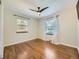 Bright bedroom features hardwood floors, natural light, and ceiling fan to offer comfort and style at 1350 E Amherst Ave, Englewood, CO 80113