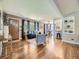 Open-concept living room with hardwood floors, modern furnishings, and natural light at 1350 E Amherst Ave, Englewood, CO 80113