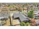 Aerial view of a single Gathering home with a long driveway and covered patio in a tree-lined neighborhood at 7819 Tejon St, Denver, CO 80221