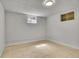 Finished basement with tile floors, recessed lighting, and egress window at 7819 Tejon St, Denver, CO 80221