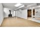 Spacious basement featuring an antique stove, white walls, and painted floor at 7819 Tejon St, Denver, CO 80221