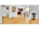 Open floor plan featuring dining area with modern lighting and view into kitchen at 7819 Tejon St, Denver, CO 80221