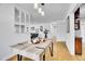 Bright dining area with bamboo floors that flows into a cozy living room and kitchen at 7819 Tejon St, Denver, CO 80221
