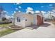 Charming single-story home with a combination of white siding and brick facade at 7819 Tejon St, Denver, CO 80221