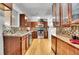 Charming kitchen featuring warm wood cabinets, and an attractive backsplash at 7819 Tejon St, Denver, CO 80221