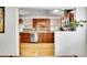 Beautiful kitchen featuring stainless steel appliances, sleek backsplash, and bamboo floors at 7819 Tejon St, Denver, CO 80221