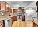 Bright kitchen offering stainless steel appliances and views to the dining area at 7819 Tejon St, Denver, CO 80221