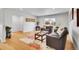 Comfortable living room featuring stylish seating, bright natural light, and bamboo floors at 7819 Tejon St, Denver, CO 80221