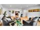 Bright living room with bamboo floors, stylish furnishings, and view into dining area at 7819 Tejon St, Denver, CO 80221
