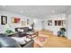 Bright living room featuring bamboo flooring, comfortable furniture, and stylish accents at 7819 Tejon St, Denver, CO 80221