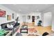 Spacious living room with beautiful bamboo floors, stylish décor, and open layout at 7819 Tejon St, Denver, CO 80221