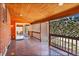 Covered patio with wood ceiling, wooden deck, adjacent to glass sliding doors into the home at 7819 Tejon St, Denver, CO 80221