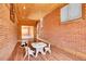 Spacious playroom featuring brick walls, wood paneled ceiling, and lots of light at 7819 Tejon St, Denver, CO 80221