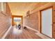 Spacious playroom featuring brick walls, wood paneled ceiling, and lots of light at 7819 Tejon St, Denver, CO 80221