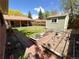 Well-maintained backyard with a shed, patio, and garden beds at 660 Wolff St, Denver, CO 80204