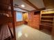 Basement bedroom features a bunk bed, desk and built in shelving at 660 Wolff St, Denver, CO 80204