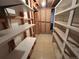 Basement shelving units on either side of a narrow storage space at 660 Wolff St, Denver, CO 80204