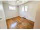Bright bedroom featuring hardwood floors, fresh paint, and a window that allows ample natural light at 660 Wolff St, Denver, CO 80204