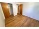 Bedroom view showcases hardwood floors and a spacious closet at 660 Wolff St, Denver, CO 80204