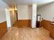 A dining room featuring wood laminate flooring and access to kitchen and entry at 660 Wolff St, Denver, CO 80204
