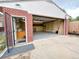 Garage with an open door and storage shelves at 660 Wolff St, Denver, CO 80204