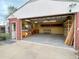 Spacious garage with storage shelves, work benches and bright lighting at 660 Wolff St, Denver, CO 80204