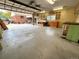 Spacious garage with storage, shelving, work benches and door to backyard at 660 Wolff St, Denver, CO 80204