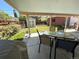 Covered patio with a dining set, view of the backyard and shed at 660 Wolff St, Denver, CO 80204
