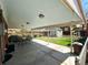 Covered patio features dining set overlooking a large backyard with a shed at 660 Wolff St, Denver, CO 80204