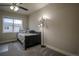 Cozy bedroom featuring carpeted floors, a ceiling fan, and a dark wood bed frame at 12254 Hazel Spruce Ct, Parker, CO 80134