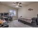 Bedroom with desk, ceiling fan, and comfortable bed, perfect for studying and relaxation at 12254 Hazel Spruce Ct, Parker, CO 80134
